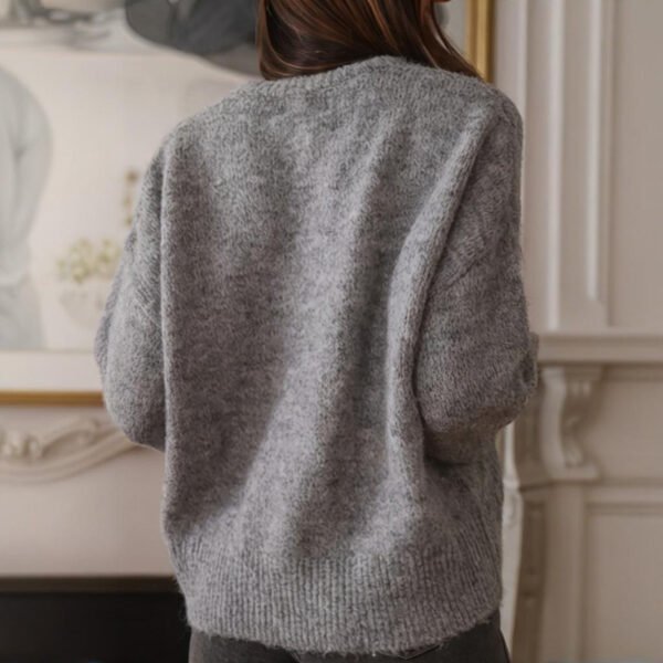 ad1c652b-813c-423b-86d1-40e36b48ac55.jpeg Suéter con puños con volantes para mujer